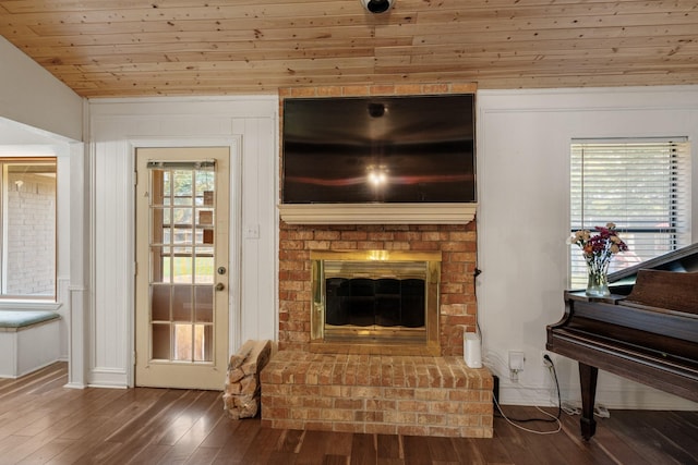 1807 Roosevelt Ct, Pantego, TX 76013 - living room featuring wood finished floors, a brick fireplace, baseboards, wood ceiling, and lofted ceiling