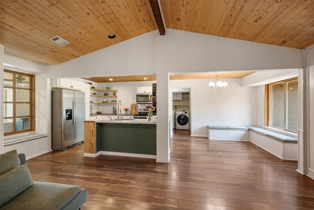 1807 Roosevelt Ct, Pantego, TX 76013 - kitchen featuring appliances with stainless steel finishes, open floor plan, open shelves, a chandelier, and white cabinets
