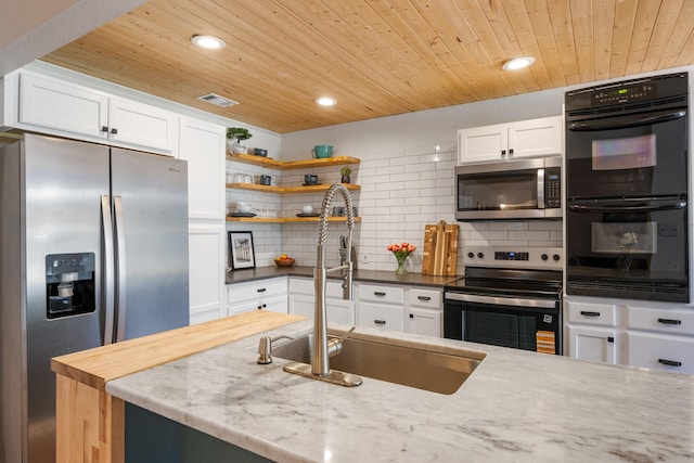 1807 Roosevelt Ct, Pantego, TX 76013 - kitchen featuring stainless steel appliances, wooden ceiling, recessed lighting, a sink, and decorative backsplash