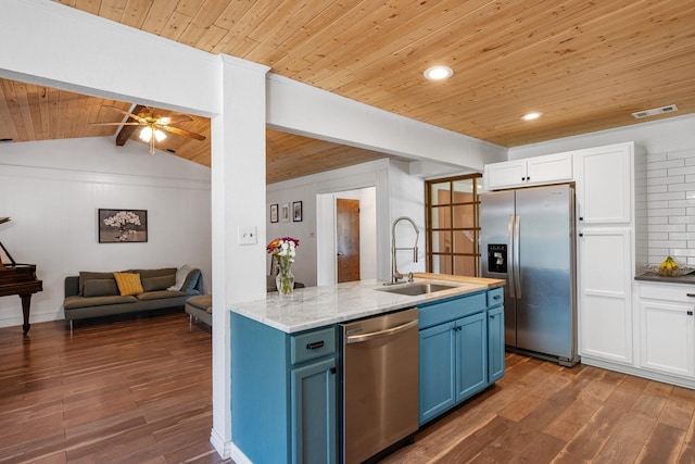 1807 Roosevelt Ct, Pantego, TX 76013 - kitchen with appliances with stainless steel finishes, a sink, wood ceiling, blue cabinets, and hardwood / wood-style floors