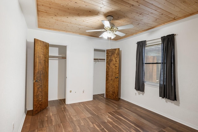 1807 Roosevelt Ct, Pantego, TX 76013 - unfurnished bedroom featuring wood ceiling, two closets, hardwood / wood-style floors, baseboards, and ceiling fan