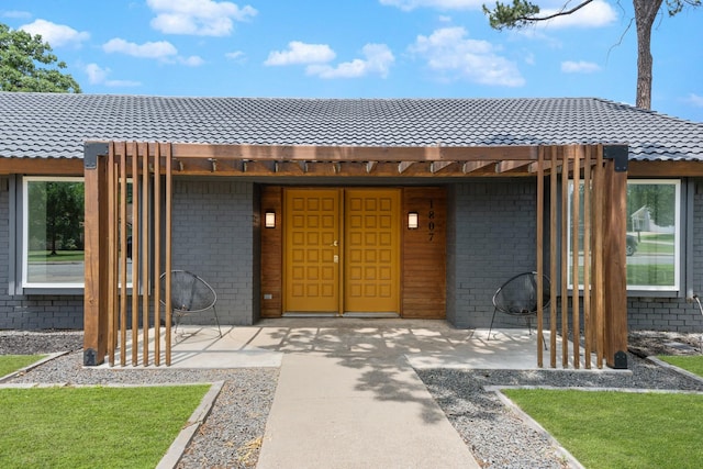 1807 Roosevelt Ct, Pantego, TX 76013 - view of front of house featuring a tiled roof and brick siding