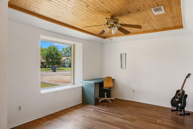 1807 Roosevelt Ct, Pantego, TX 76013 - spare room with wooden ceiling, a tray ceiling, ceiling fan, wood finished floors, and baseboards