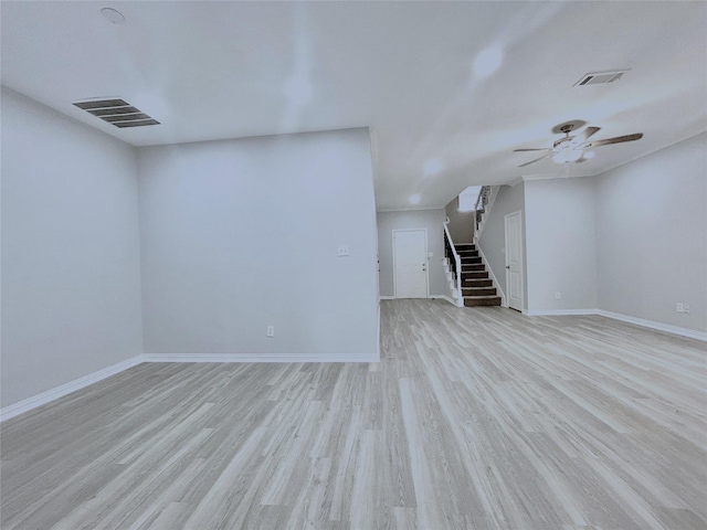 2324 Homewood Ln, Grand Prairie, TX 75050 - empty room featuring stairway, light wood-style flooring, a ceiling fan, and baseboards
