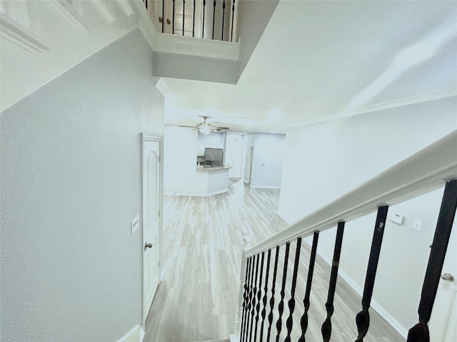 2324 Homewood Ln, Grand Prairie, TX 75050 - staircase featuring wood finished floors, a ceiling fan, baseboards, and ornamental molding