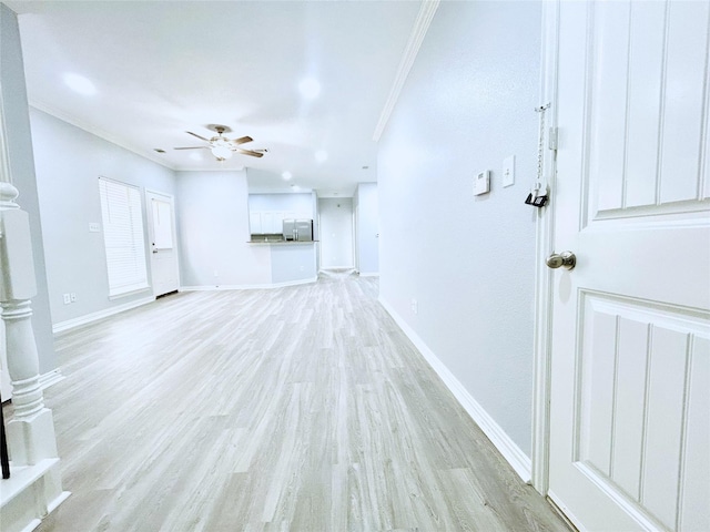 2324 Homewood Ln, Grand Prairie, TX 75050 - unfurnished living room with crown molding, a ceiling fan, light wood-style floors, and baseboards