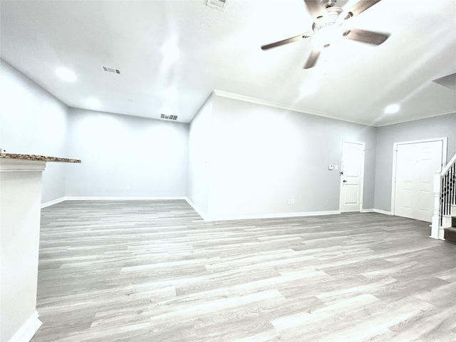 2324 Homewood Ln, Grand Prairie, TX 75050 - unfurnished living room featuring a ceiling fan, wood finished floors, stairs, baseboards, and crown molding