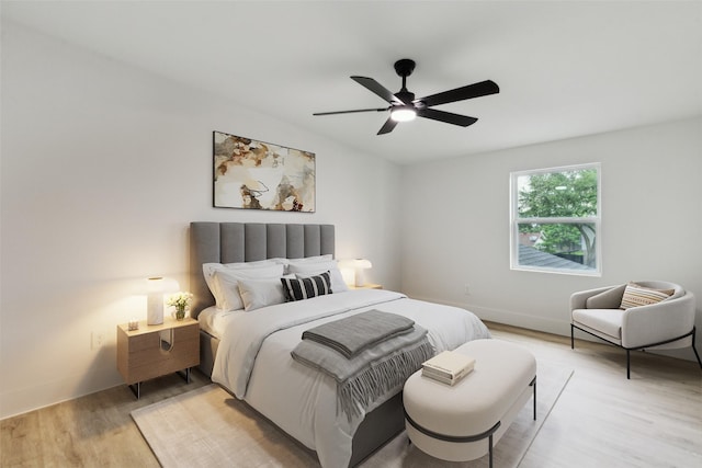 1309 Northpark Dr, Richardson, TX 75081 - bedroom with light wood-type flooring and a ceiling fan
