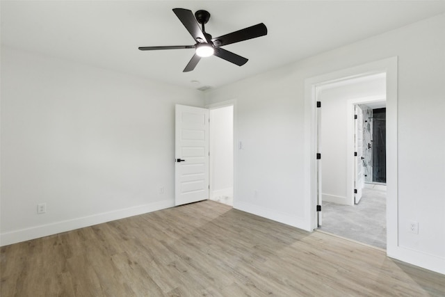 1309 Northpark Dr, Richardson, TX 75081 - unfurnished bedroom featuring light wood-style flooring, baseboards, and a ceiling fan