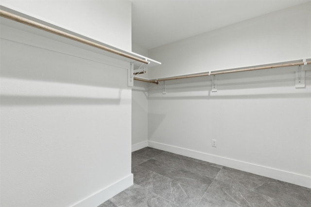1309 Northpark Dr, Richardson, TX 75081 - spacious closet featuring tile patterned flooring