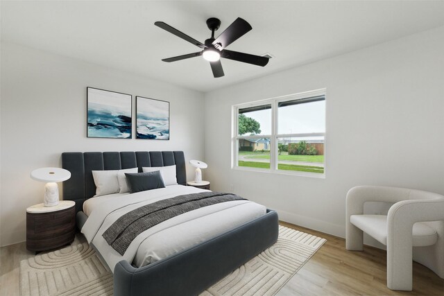 1309 Northpark Dr, Richardson, TX 75081 - bedroom featuring light wood finished floors, baseboards, and a ceiling fan