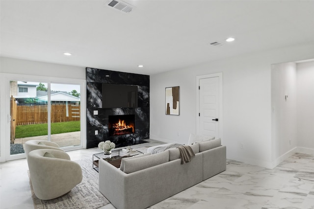 1309 Northpark Dr, Richardson, TX 75081 - living area featuring a fireplace, recessed lighting, marble finish floors, and baseboards