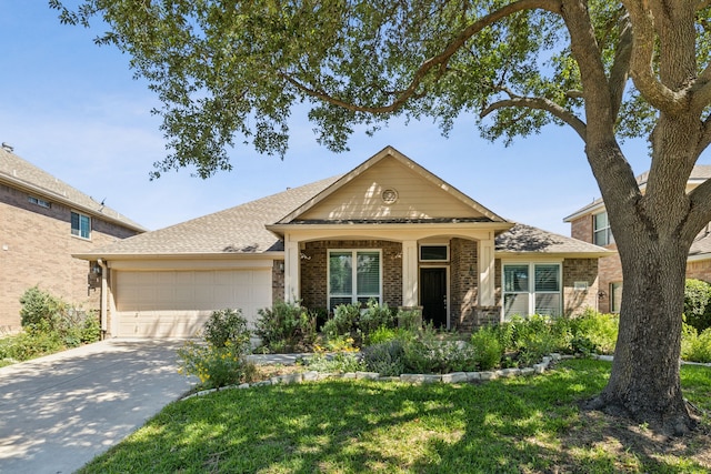 7308 Claridge Ln, Mckinney, TX 75072 - view of front of property with a garage, brick siding, and concrete driveway