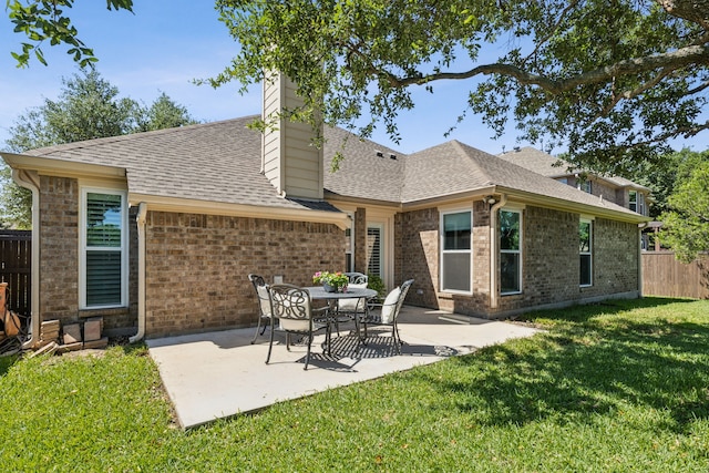 7308 Claridge Ln, Mckinney, TX 75072 - rear view of property featuring brick siding, roof with shingles, a patio area, and a chimney
