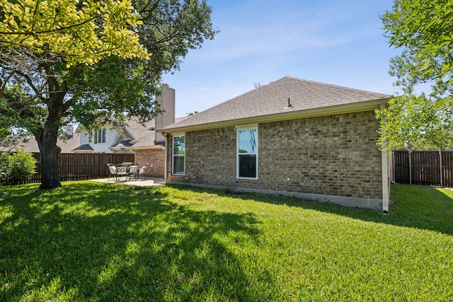 7308 Claridge Ln, Mckinney, TX 75072 - rear view of house with brick siding, a patio, a shingled roof, and a chimney