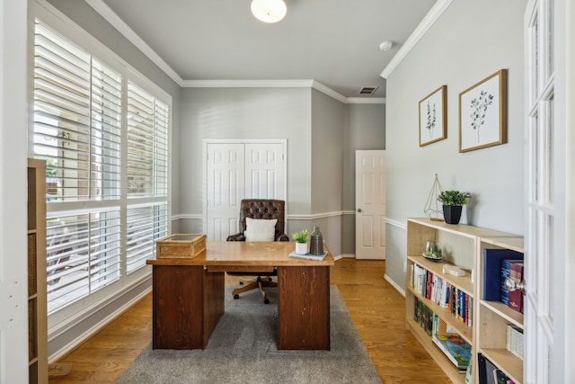 7308 Claridge Ln, Mckinney, TX 75072 - office with plenty of natural light, ornamental molding, wood finished floors, and baseboards