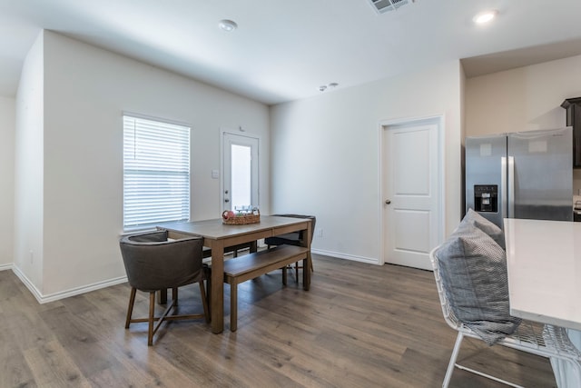 6514 Whitecap Dr, Princeton, TX 75407 - dining area with wood finished floors, baseboards, and recessed lighting
