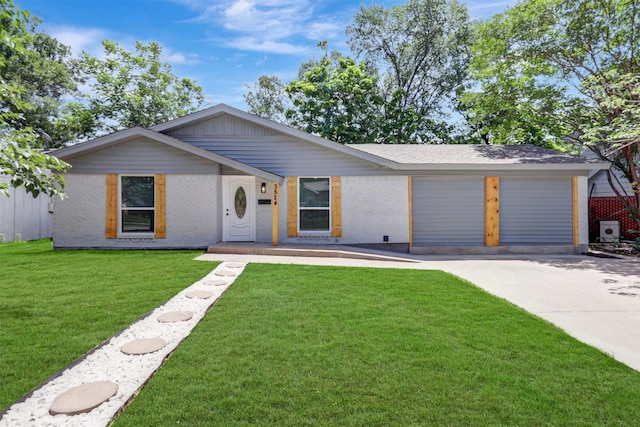 3524 Bahamas Dr, Mesquite, TX 75150 - view of front facade with brick siding, concrete driveway, a front lawn, and an attached garage