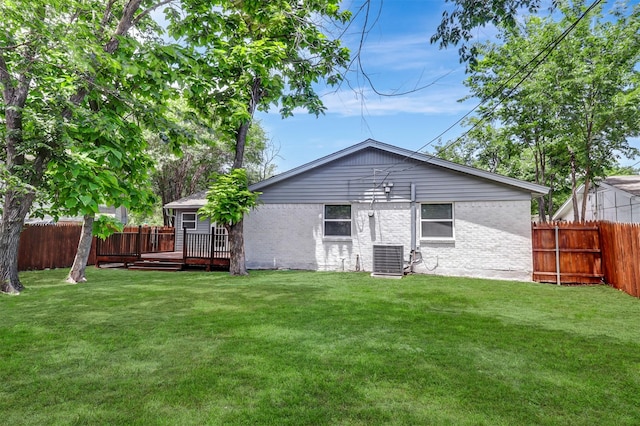 3524 Bahamas Dr, Mesquite, TX 75150 - back of property featuring brick siding, a deck, and central air condition unit