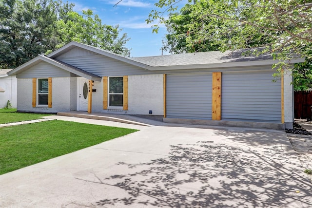 3524 Bahamas Dr, Mesquite, TX 75150 - view of front of home with a garage, brick siding, and driveway
