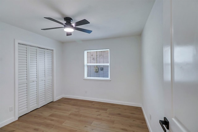 3524 Bahamas Dr, Mesquite, TX 75150 - unfurnished bedroom featuring light wood-style flooring, baseboards, a ceiling fan, and a closet