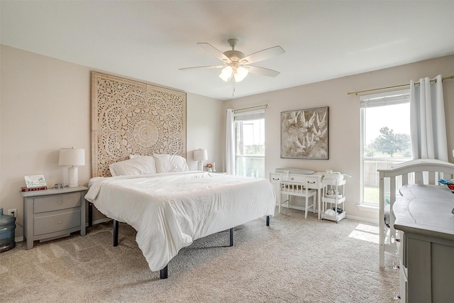 412 Hanover St, Burleson, TX 76028 - bedroom with light colored carpet, multiple windows, a ceiling fan, and baseboards