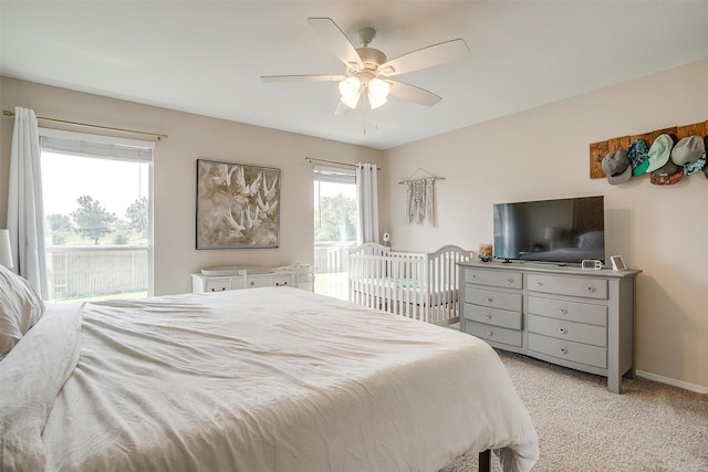 412 Hanover St, Burleson, TX 76028 - bedroom with access to exterior, light colored carpet, a ceiling fan, and baseboards
