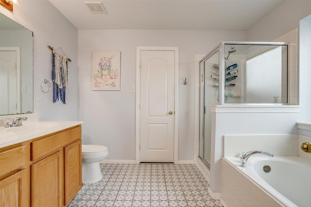 412 Hanover St, Burleson, TX 76028 - bathroom with tile patterned floors, vanity, a bath, a shower stall, and toilet