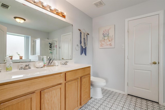 412 Hanover St, Burleson, TX 76028 - bathroom featuring a shower stall, double vanity, toilet, and tile patterned floors