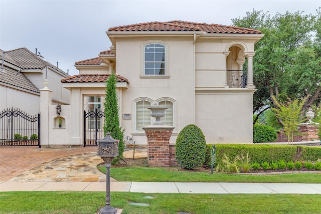 5528 Gleneagles Dr, Plano, TX 75093 - mediterranean / spanish home featuring a tile roof, stucco siding, and a gate