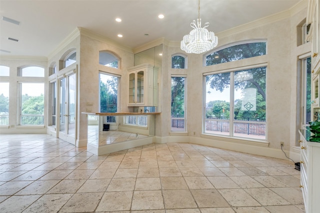5528 Gleneagles Dr, Plano, TX 75093 - unfurnished sunroom featuring plenty of natural light, a chandelier, and french doors