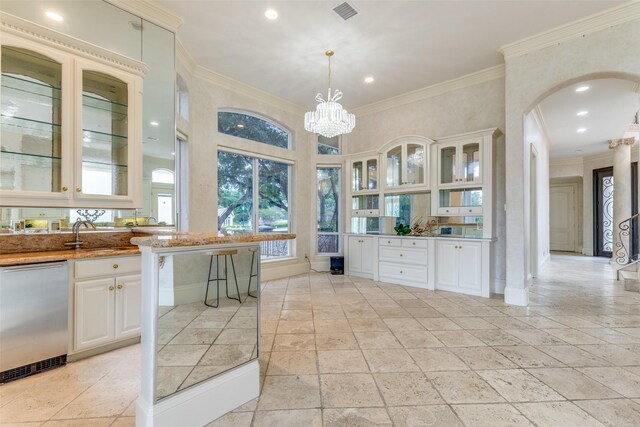 5528 Gleneagles Dr, Plano, TX 75093 - kitchen featuring dishwasher, arched walkways, crown molding, a sink, and glass insert cabinets