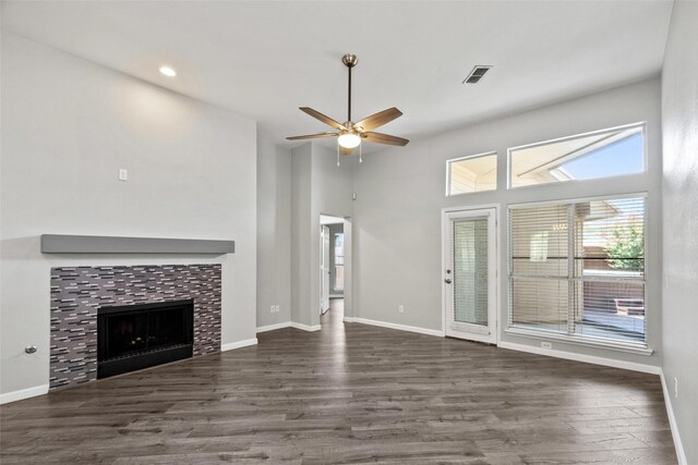 5409 Highlands Dr, Mckinney, TX 75070 - unfurnished living room featuring healthy amount of natural light, ceiling fan, a tile fireplace, wood finished floors, and recessed lighting