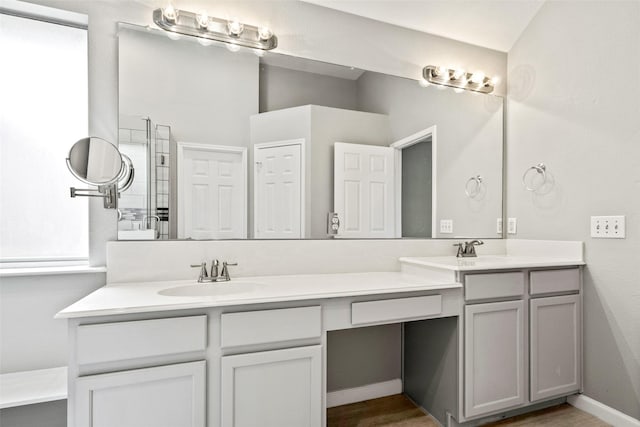 5409 Highlands Dr, Mckinney, TX 75070 - full bath featuring double vanity and wood finished floors