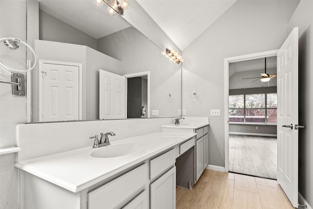 5409 Highlands Dr, Mckinney, TX 75070 - bathroom with vaulted ceiling, double vanity, ceiling fan, and baseboards