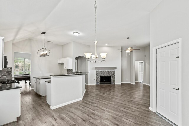 5409 Highlands Dr, Mckinney, TX 75070 - kitchen featuring dark countertops, a chandelier, white cabinetry, dark wood finished floors, and ceiling fan
