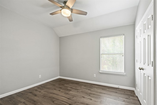 5409 Highlands Dr, Mckinney, TX 75070 - unfurnished bedroom with lofted ceiling, baseboards, dark wood-type flooring, and a ceiling fan