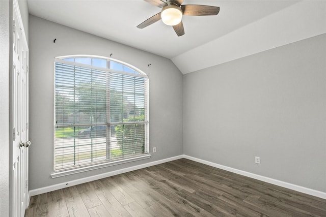 5409 Highlands Dr, Mckinney, TX 75070 - unfurnished room with a ceiling fan, dark wood-style flooring, lofted ceiling, and baseboards