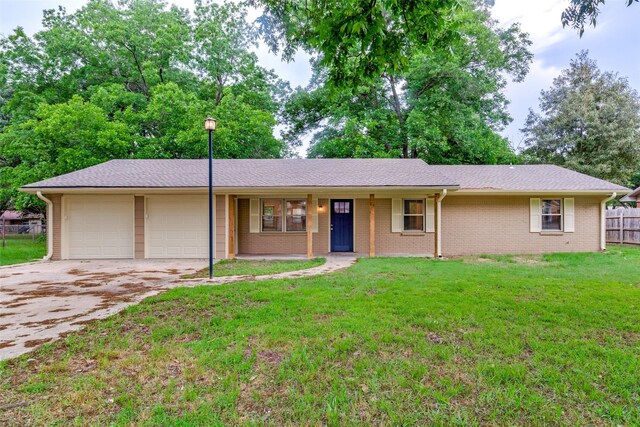505 Locust St, Edgewood, TX 75117 - ranch-style home featuring an attached garage, driveway, brick siding, and roof with shingles