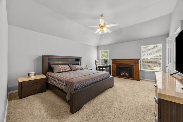 60 Misty Mesa Trl, Mansfield, TX 76063 - bedroom with light carpet, baseboards, lofted ceiling, a warm lit fireplace, and ceiling fan