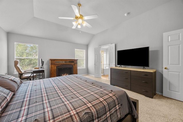 60 Misty Mesa Trl, Mansfield, TX 76063 - bedroom featuring multiple windows, light colored carpet, baseboards, vaulted ceiling, and a lit fireplace
