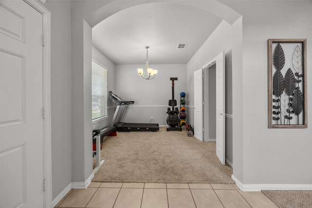 60 Misty Mesa Trl, Mansfield, TX 76063 - workout area featuring carpet, arched walkways, a chandelier, and tile patterned flooring
