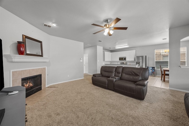 60 Misty Mesa Trl, Mansfield, TX 76063 - living area with a ceiling fan, light colored carpet, a tile fireplace, and baseboards