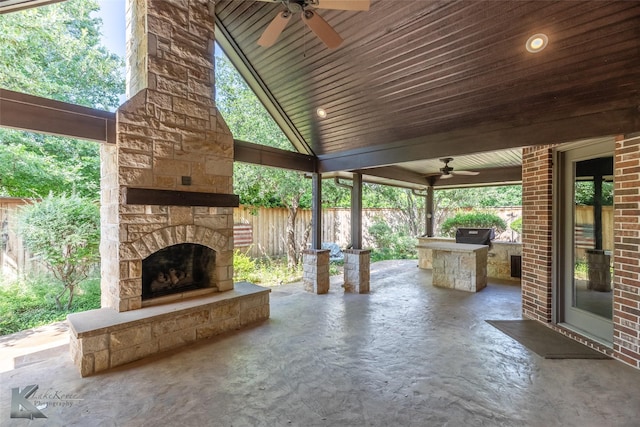 2326 Innisbrook Dr, Abilene, TX 79606 - view of patio featuring an outdoor stone fireplace, a ceiling fan, and area for grilling