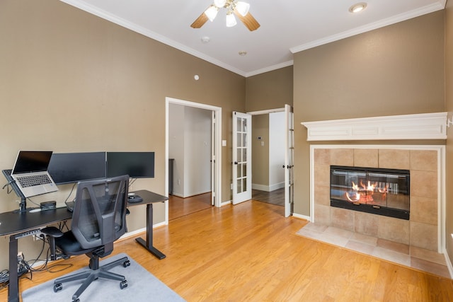 142 Shelby Trce, Murphy, TX 75094 - home office featuring ceiling fan, light wood finished floors, french doors, crown molding, and a tile fireplace