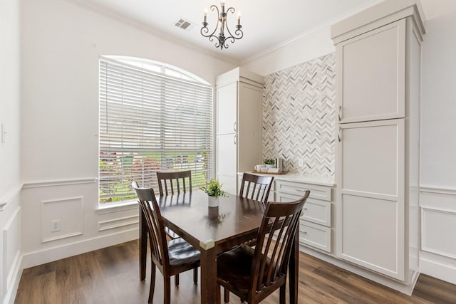 142 Shelby Trce, Murphy, TX 75094 - dining area featuring ornamental molding, dark wood-style floors, wainscoting, and a chandelier