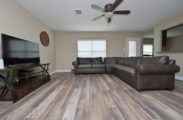 122 Buffalo Ridge Dr, Newark, TX 76071 - living room featuring a ceiling fan, wood finished floors, healthy amount of natural light, and baseboards