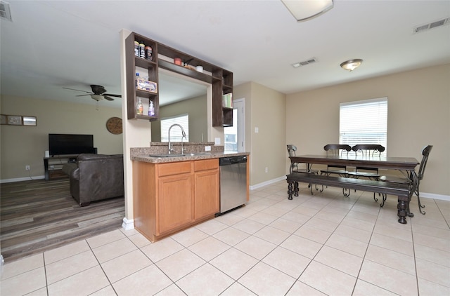 122 Buffalo Ridge Dr, Newark, TX 76071 - kitchen featuring stainless steel dishwasher, ceiling fan, a sink, open shelves, and baseboards