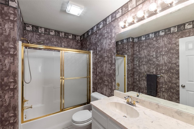 431 Jib Dr, Gun Barrel City, TX 75156 - bathroom featuring toilet, vanity, enclosed tub / shower combo, and wallpapered walls
