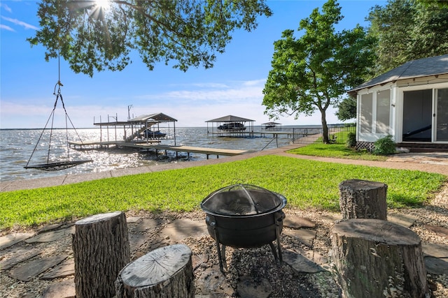 431 Jib Dr, Gun Barrel City, TX 75156 - view of yard featuring an outdoor fire pit, a dock, boat lift, and a water view